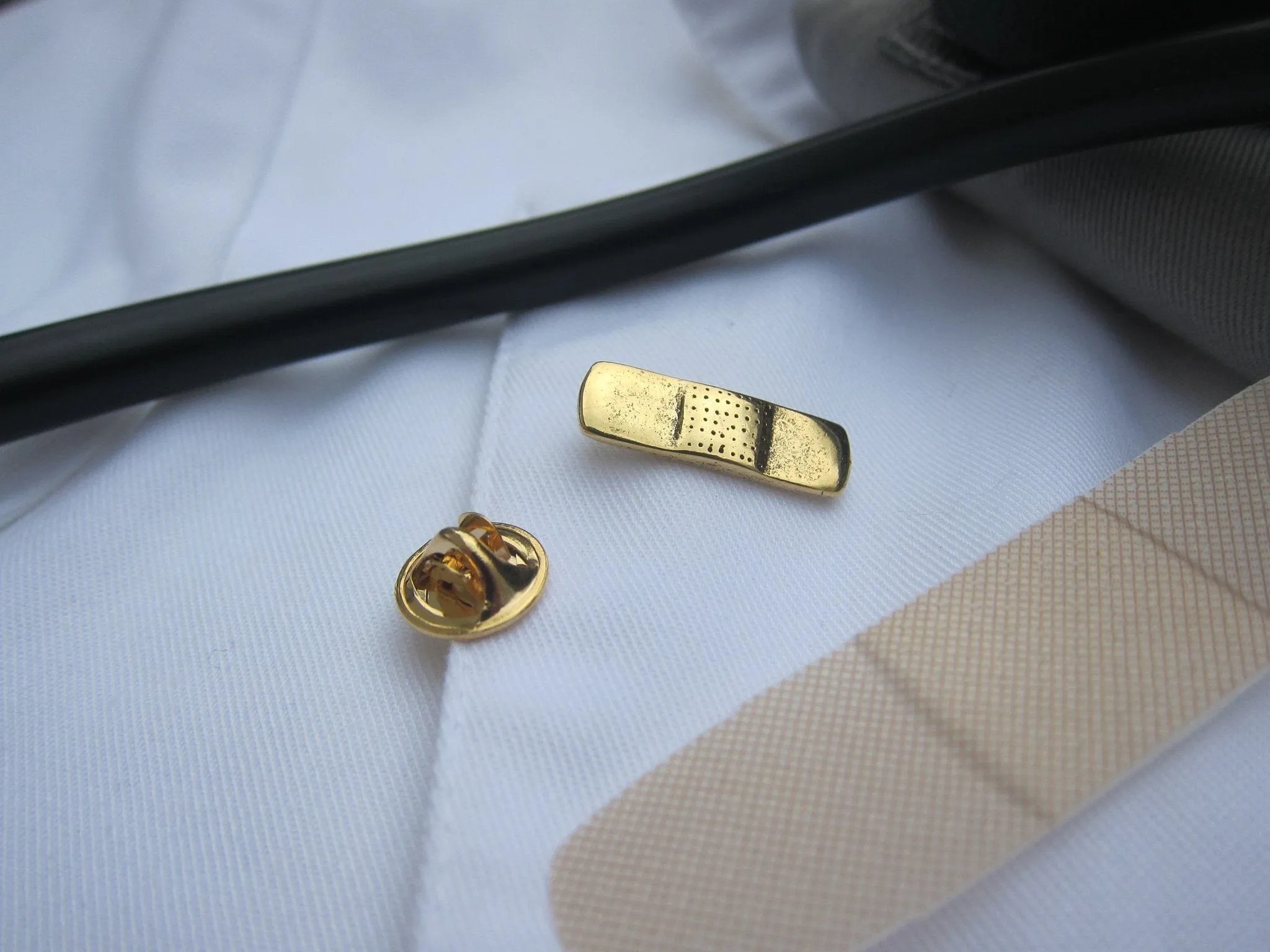 Band Aid Gold Lapel Pin