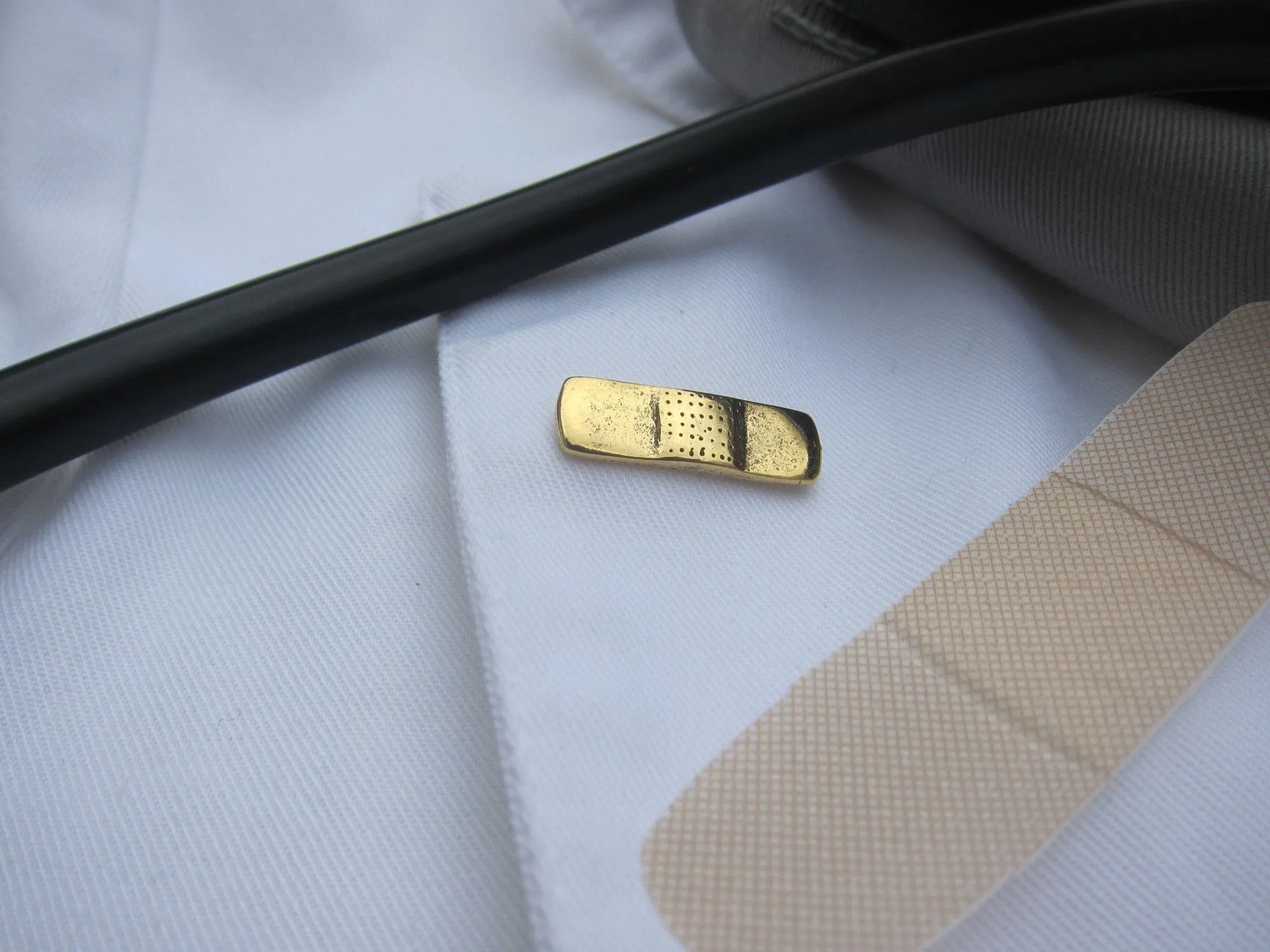 Band Aid Gold Lapel Pin