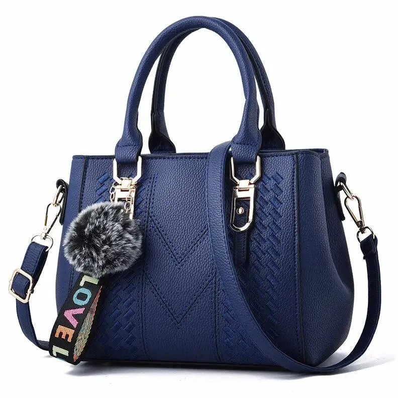 Elegant Embroidered Satchel with Charm