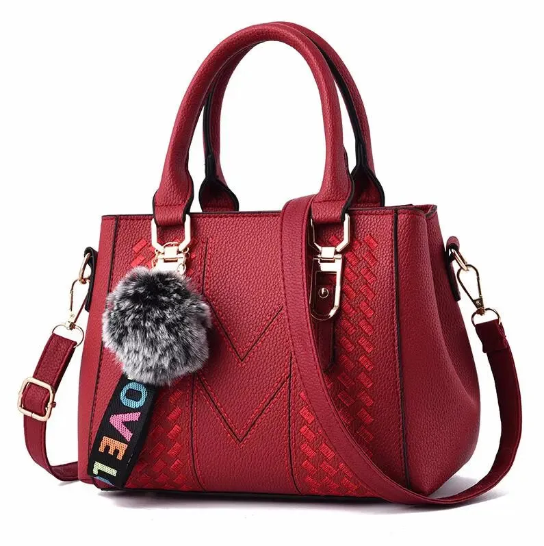 Elegant Embroidered Satchel with Charm