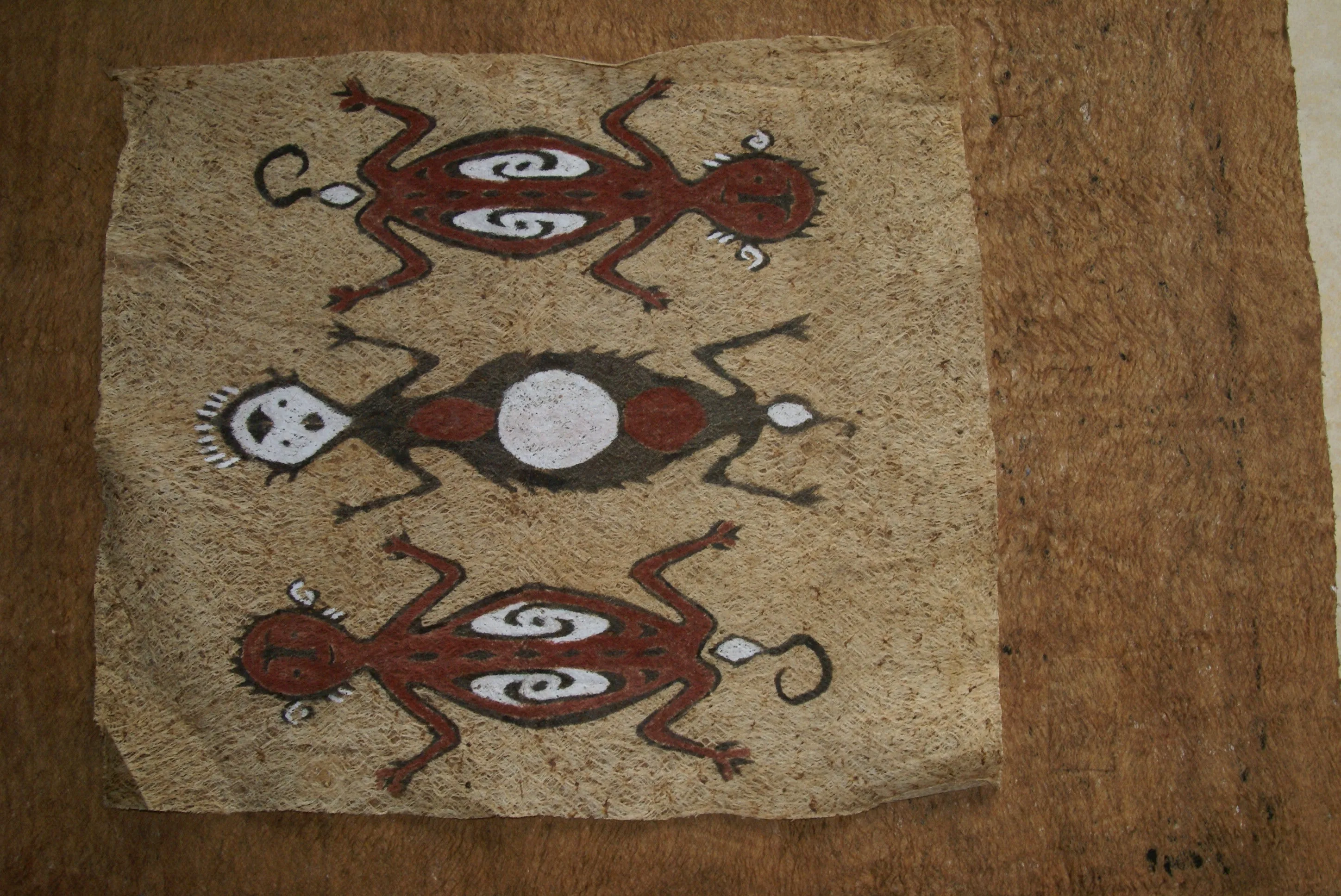 Rare Tapa Bark Cloth (Kapa in Hawaii), from Lake Sentani, Irian Jaya, Papua New Guinea. Hand painted by a Tribal Artist with natural pigments: Spiritual Stylized People Morphing into Geckos 16" x 14" (no 25)