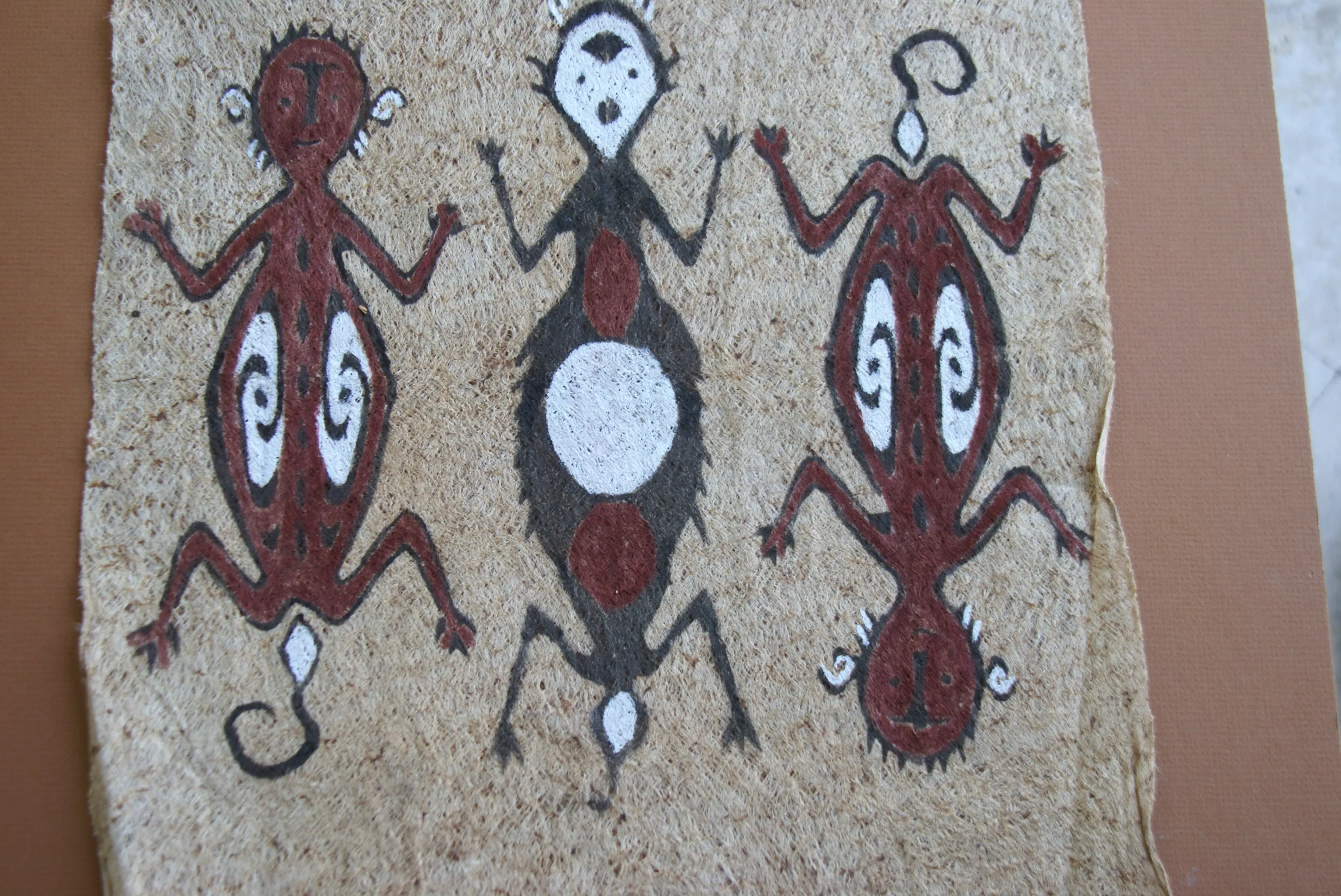 Rare Tapa Bark Cloth (Kapa in Hawaii), from Lake Sentani, Irian Jaya, Papua New Guinea. Hand painted by a Tribal Artist with natural pigments: Spiritual Stylized People Morphing into Geckos 16" x 14" (no 25)