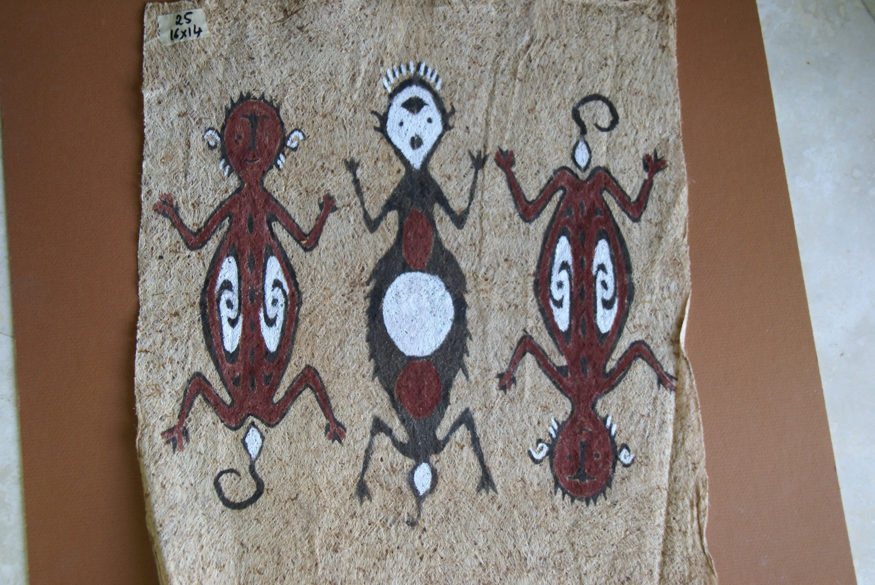 Rare Tapa Bark Cloth (Kapa in Hawaii), from Lake Sentani, Irian Jaya, Papua New Guinea. Hand painted by a Tribal Artist with natural pigments: Spiritual Stylized People Morphing into Geckos 16" x 14" (no 25)